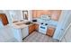 Functional kitchen with white appliances, a breakfast bar, and plenty of cabinet storage at 300 Falling Water Dr, Kissimmee, FL 34759