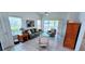 Bright living room features tile flooring, neutral paint, and sliding glass doors to outdoor living space at 300 Falling Water Dr, Kissimmee, FL 34759