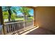 View from the screened-in patio overlooking the community with lush landscaping at 300 Falling Water Dr, Kissimmee, FL 34759