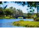 Scenic stone bridge over a pond in the Solivita community at 300 Falling Water Dr, Kissimmee, FL 34759