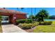 Community pool area with tropical landscaping, lake view, and convenient pool access with updated pool rules at 300 Falling Water Dr, Kissimmee, FL 34759