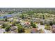 Aerial view of a home with a large, fenced backyard in a desirable community near a lake at 323 Azincourt Ln, Kissimmee, FL 34759