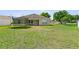 Large backyard features lush grass and room for activities at 323 Azincourt Ln, Kissimmee, FL 34759