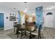 Open dining area with wood-look floors and modern lighting at 323 Azincourt Ln, Kissimmee, FL 34759
