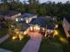 Expansive two-story home features lush landscaping, brick-paved driveway, and a fully enclosed swimming pool at 3245 Heirloom Rose Pl, Oviedo, FL 32766