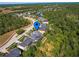 Stunning aerial view of home with mature trees and a serene lake in a desirable neighborhood at 3245 Heirloom Rose Pl, Oviedo, FL 32766