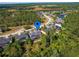 Beautiful aerial view of home with mature trees and a serene lake in a desirable neighborhood at 3245 Heirloom Rose Pl, Oviedo, FL 32766