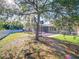 This landscaped backyard provides plenty of green space and includes a screened-in pool for outdoor enjoyment at 3245 Heirloom Rose Pl, Oviedo, FL 32766