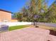 The backyard boasts a brick-paved area, a basketball hoop, and a well-maintained lawn at 3245 Heirloom Rose Pl, Oviedo, FL 32766