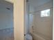 The bathroom features a toilet and a shower/tub combo with a window for natural light at 3245 Heirloom Rose Pl, Oviedo, FL 32766