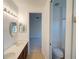 The bathroom features double sinks with a view into the bedroom and a doorway to the toilet and shower at 3245 Heirloom Rose Pl, Oviedo, FL 32766