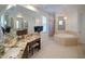 Bathroom with double vanity, granite countertops, soaking tub and glass shower at 3245 Heirloom Rose Pl, Oviedo, FL 32766