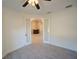 Bedroom featuring tile floors, a ceiling fan, and a french door access to the rest of the house at 3245 Heirloom Rose Pl, Oviedo, FL 32766