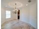 Charming dining area featuring a decorative chandelier, neutral walls, and tiled floor at 3245 Heirloom Rose Pl, Oviedo, FL 32766