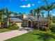 A charming two-story home with well-manicured landscaping and a spacious driveway at 3245 Heirloom Rose Pl, Oviedo, FL 32766