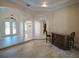 Spacious foyer with elegant tile flooring, arched doorways, and decorative columns at 3245 Heirloom Rose Pl, Oviedo, FL 32766