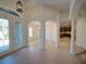 Welcoming foyer with decorative columns, tile flooring, and arched doorways, offering open transitions at 3245 Heirloom Rose Pl, Oviedo, FL 32766