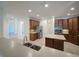Spacious kitchen with wood cabinets, an island, stainless appliances, and tile floor at 3245 Heirloom Rose Pl, Oviedo, FL 32766