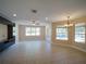 Spacious living room featuring tile floors, a ceiling fan, recessed lighting, and sliding glass doors to a lanai at 3245 Heirloom Rose Pl, Oviedo, FL 32766