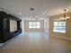 Spacious living room features tile flooring, natural light, and seamless access to the outdoor pool area at 3245 Heirloom Rose Pl, Oviedo, FL 32766