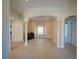 Bright living space featuring elegant columns, tile flooring, and a view to another room at 3245 Heirloom Rose Pl, Oviedo, FL 32766