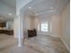 Inviting living space with tile flooring, columns, and a pool view through large windows at 3245 Heirloom Rose Pl, Oviedo, FL 32766
