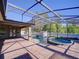 Screened-in pool and patio area features a waterfall, spa, and plenty of room for entertaining at 3245 Heirloom Rose Pl, Oviedo, FL 32766
