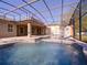 The screened-in pool features a spa, a waterfall, a brick-paver patio, and seamless access to the house at 3245 Heirloom Rose Pl, Oviedo, FL 32766