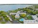 Stunning aerial view of the community with a sparkling pool and lush landscaping, near the lake at 333 Lake Howard Dr Nw # 204D, Winter Haven, FL 33880