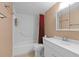 A full bathroom with a shower-tub combo and a white vanity at 333 Lake Howard Dr Nw # 204D, Winter Haven, FL 33880