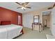 Relaxing bedroom with ample closet space, an accent mirror, and a comfortable bed at 333 Lake Howard Dr Nw # 204D, Winter Haven, FL 33880