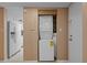 A laundry closet features a stacked washer and dryer at 333 Lake Howard Dr Nw # 204D, Winter Haven, FL 33880