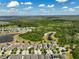 An aerial shot showing the homes surrounded by the beauty of green spaces, ponds, and natural landscape at 3447 Feathergrass Ct, Harmony, FL 34773