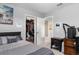 Bedroom with a large closet, bed, TV, and a desk perfect for a home office setup at 3447 Feathergrass Ct, Harmony, FL 34773