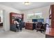Carpeted bonus room with two computer workstations, each with large monitors and gaming chairs at 3447 Feathergrass Ct, Harmony, FL 34773