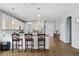 Bright, open kitchen with stainless steel appliances, granite countertops, and a breakfast bar with seating at 3447 Feathergrass Ct, Harmony, FL 34773
