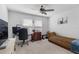 Home office with natural light, comfortable seating, and a large desk area at 3447 Feathergrass Ct, Harmony, FL 34773