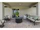 Relaxing outdoor patio featuring comfortable seating, a fire pit, and a barbecue grill at 3447 Feathergrass Ct, Harmony, FL 34773