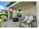 Cozy outdoor patio with comfortable seating, a fire pit, a barbecue grill, and lush greenery at 3447 Feathergrass Ct, Harmony, FL 34773