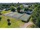 Enjoy this aerial view of the neighborhood tennis courts, a perfect spot for community sports and recreation at 3447 Feathergrass Ct, Harmony, FL 34773