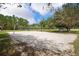 Community volleyball court with sandy surface, perfect for beach volleyball and outdoor recreation at 3447 Feathergrass Ct, Harmony, FL 34773