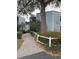 A well-maintained building exterior with mature trees and landscaping leading to the entrance at 3592 Southpointe Dr # 2, Orlando, FL 32822