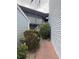 Exterior view of building with lush landscaping and a brick pathway, well-maintained property at 3592 Southpointe Dr # 2, Orlando, FL 32822