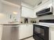 Efficient kitchen with stainless steel appliances, granite countertops, and ample cabinet space at 3592 Southpointe Dr # 2, Orlando, FL 32822
