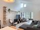 Open-concept living room with vaulted ceilings, neutral decor, and sliding glass door to the lanai at 3592 Southpointe Dr # 2, Orlando, FL 32822