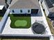 Aerial view of a well-maintained backyard with a putting green and trampoline at 372 Meadow Pointe Dr, Haines City, FL 33844