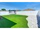 Picturesque backyard featuring a putting green and a trampoline at 372 Meadow Pointe Dr, Haines City, FL 33844