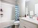Bathroom with a shower-tub combination and a white vanity at 372 Meadow Pointe Dr, Haines City, FL 33844