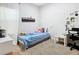 This cozy bedroom has a window, a desk, and a comfortable bed at 372 Meadow Pointe Dr, Haines City, FL 33844