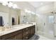 Beautiful bathroom featuring a spacious shower with glass door and vanity with stone countertop at 3775 Via Mazzini Ct, Kissimmee, FL 34759